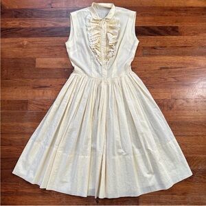 Elegant Cream Sleeveless Dress with Ruffle Detail